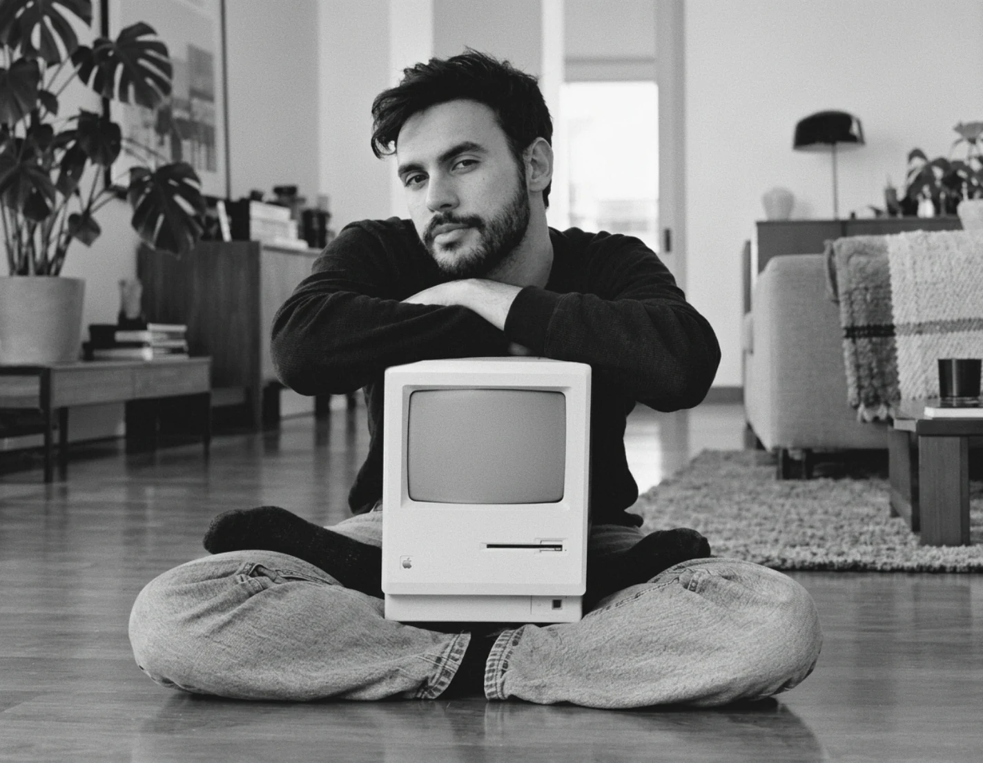 Alex Santos with an original Macintosh computer